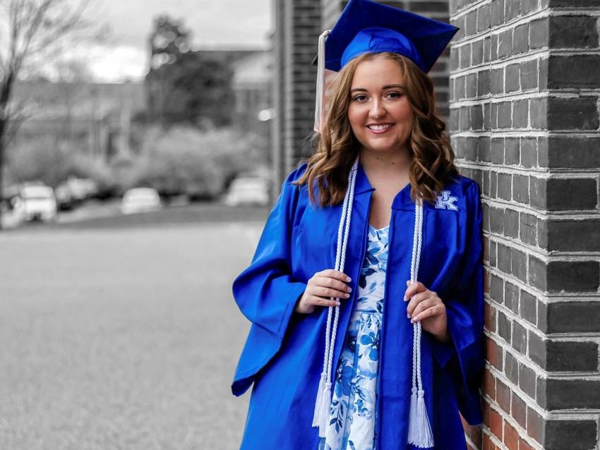 a photograph of Ashley Duff in their graduation robes