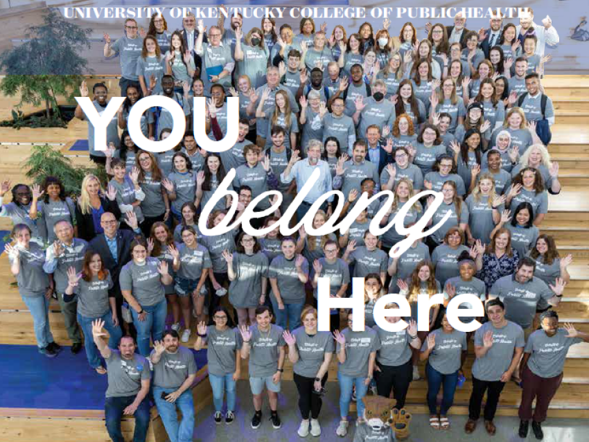 a photograph of a group of College of Public Health members sitting on stairs and waiving