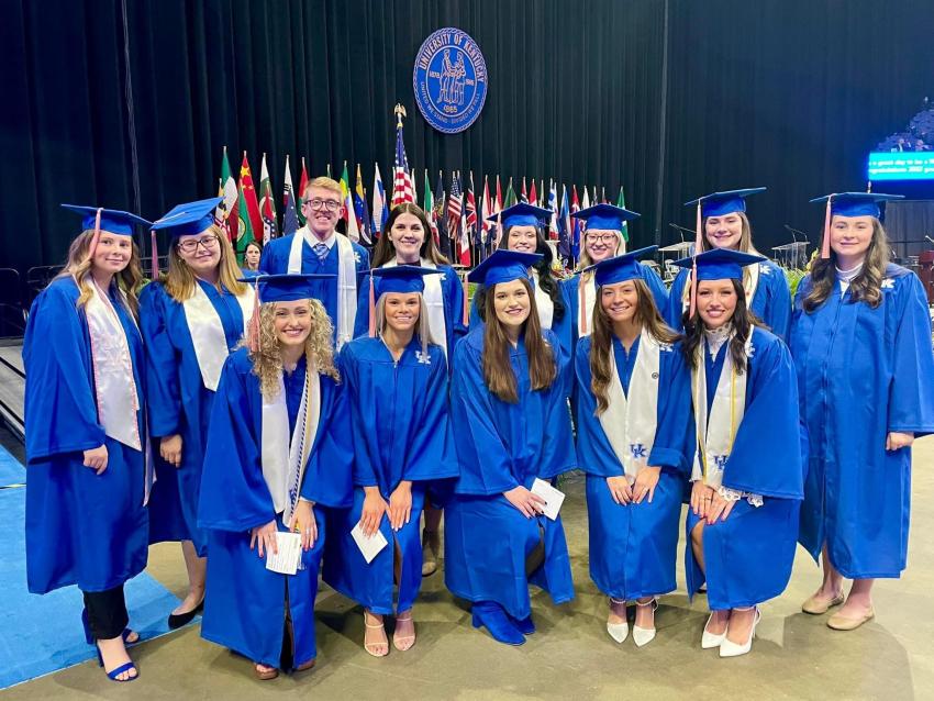 Group picture of students in regalia at graduation ceremony