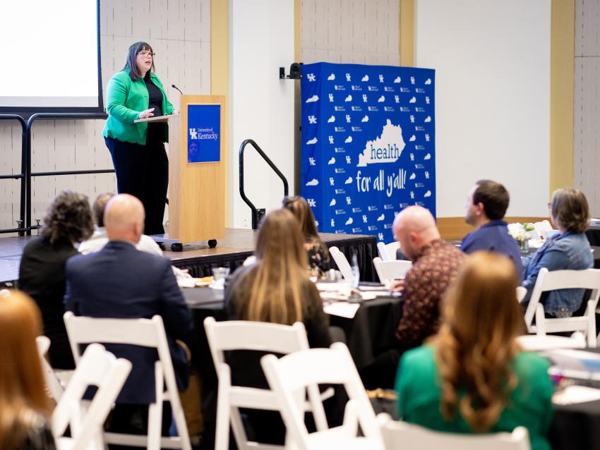Dean Heather Bush speaking to audience members on stage