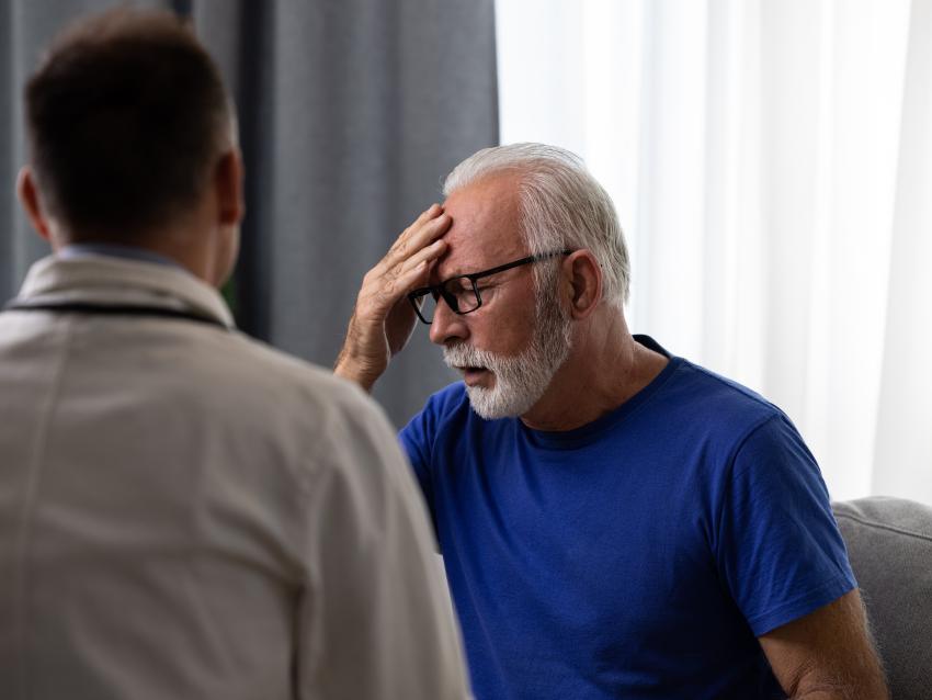 Doctor physician talking to distressed, sad senior patient having bad diagnosis, disease or health problem. Elderly medical health care concept