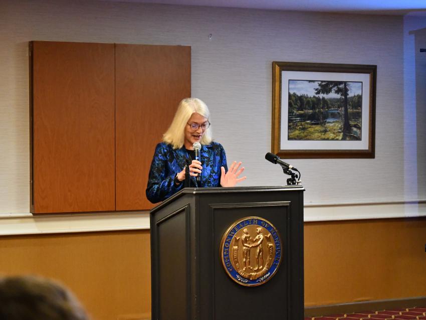 a photograph of Terry Bunn speaking at a podium