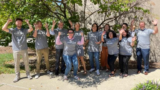 a photograph of College of Public Health faculty and staff wearing the "Pump It Up" t-shirt