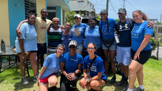 Group picture of public health students with Dr. Ketrell McWhorter in Puerto Rico, part of disaster relief trip in July 2023